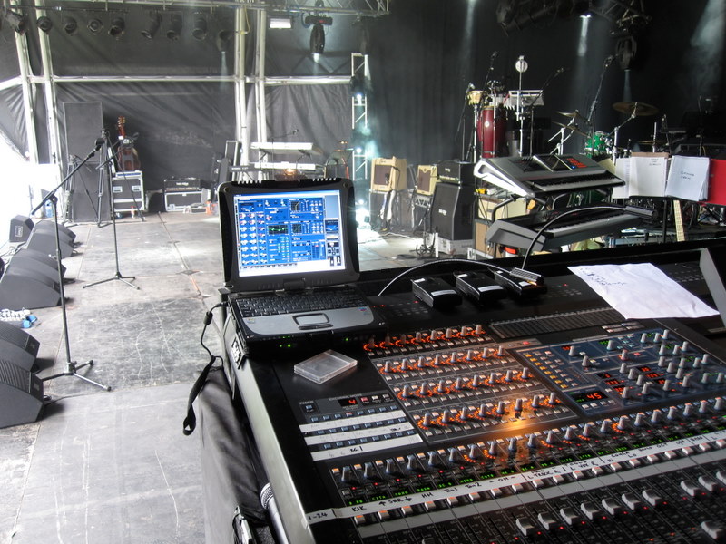 Monitor mix position set up at the side of a concert stage