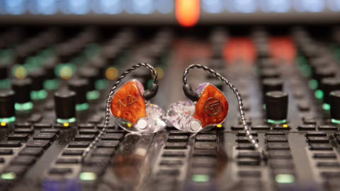 In which cases should you use ear monitors to improve the quality of stage monitoring for singers and musicians?
