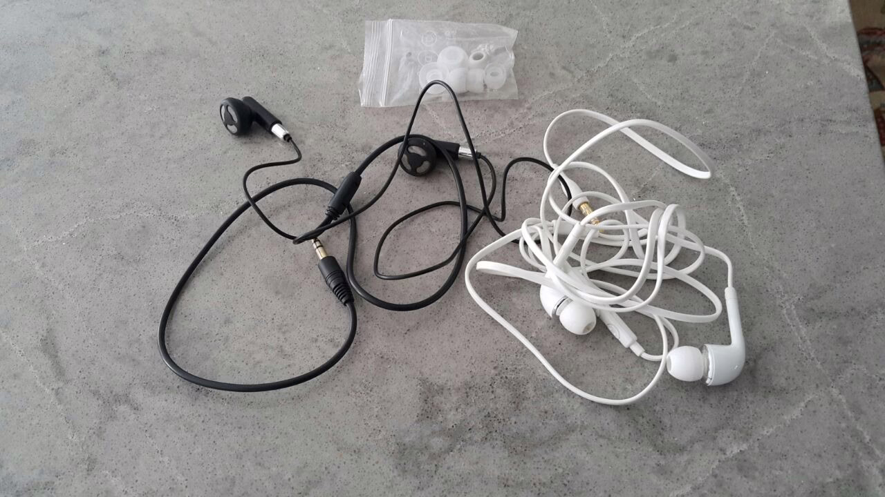 Pair of in-ear stage monitors with their detachable cable