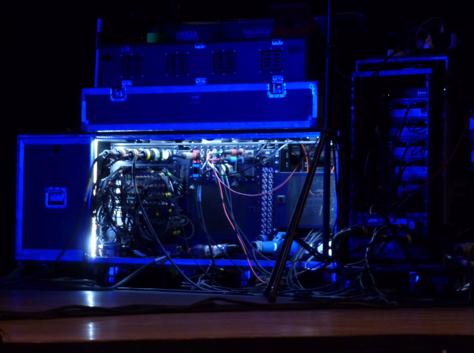 Open rack at the mix position showing the patch cabling between console and system