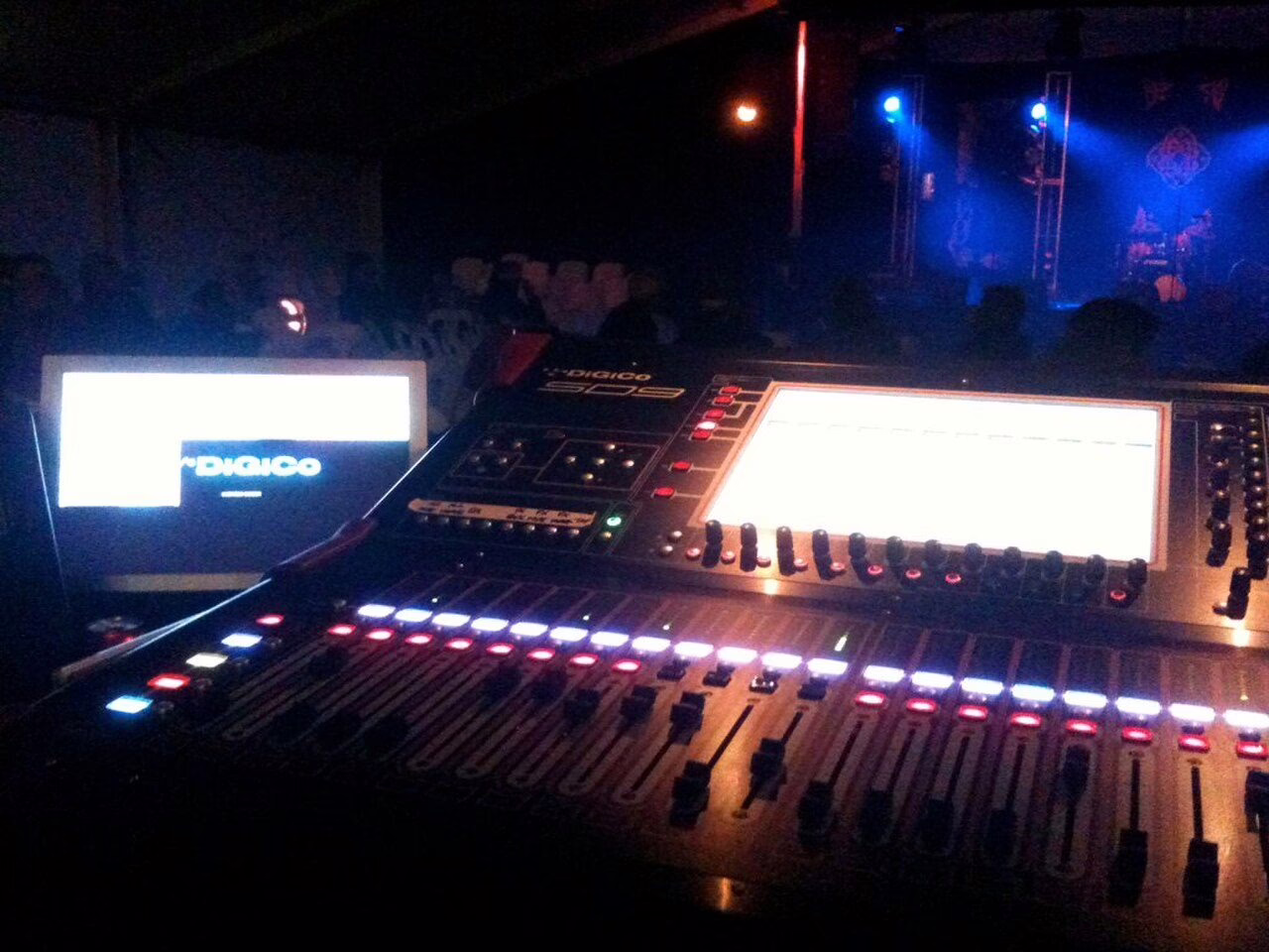 DiGiCo digital mixing console at the front-of-house position during a festival