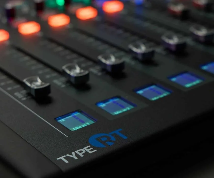 Calrec Type RT in use, with motorised faders and control screen