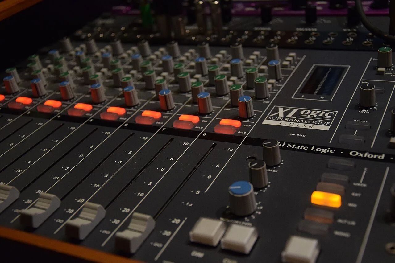 Analogue console channel strip with its gain, EQ and dynamics controls