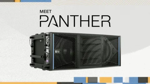 Un line array accroché pour la diffusion d'un concert en grande salle